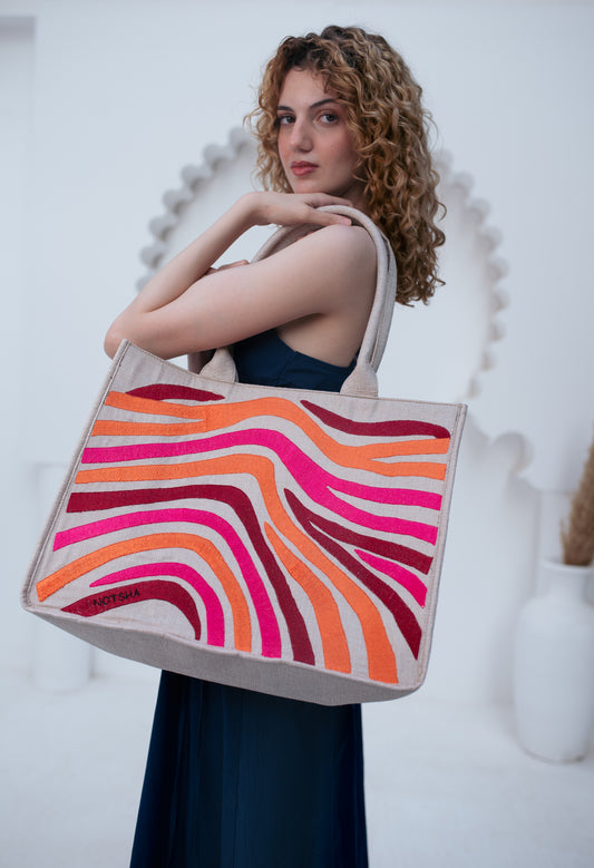 A bold blend of orange, burgundy, and fuchsia.