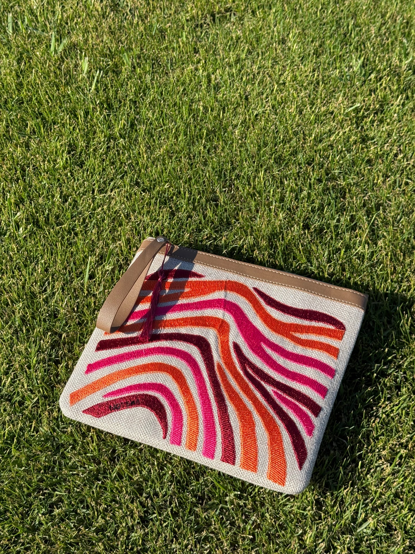 A bold blend of orange, burgundy, and fuchsia.