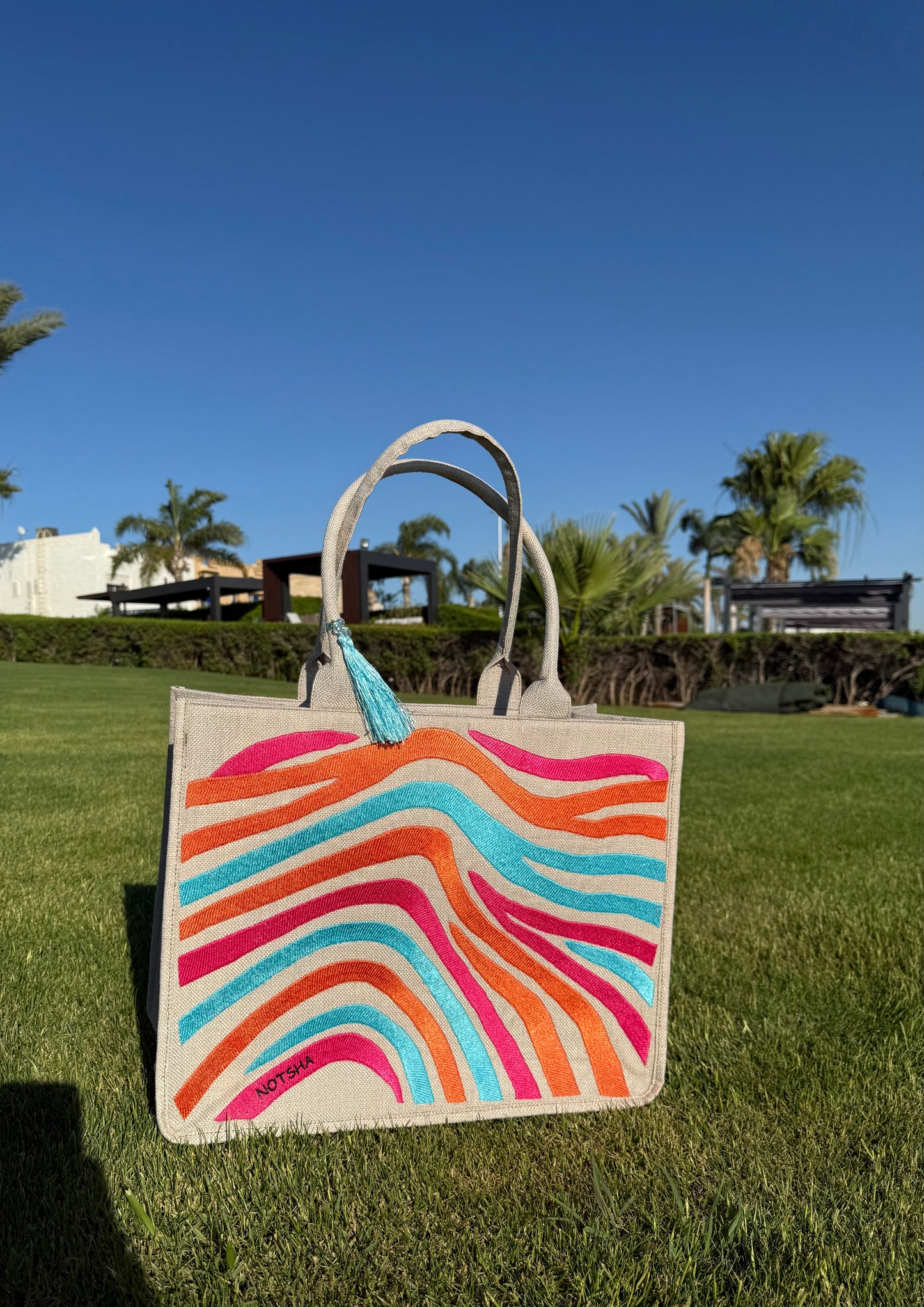 A vibrant blend of turquoise, orange, and fuchsia.