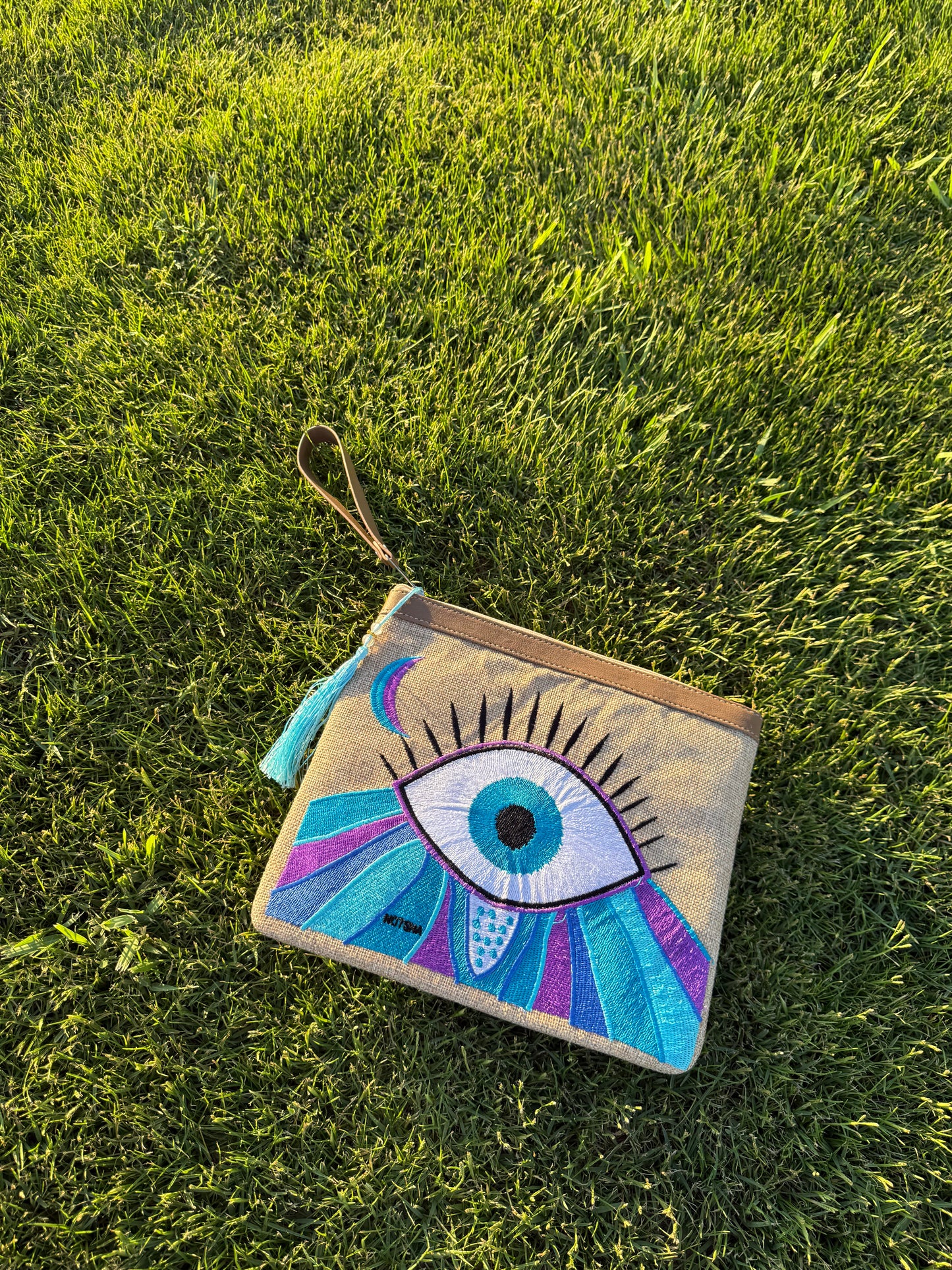 Purple with baby blue Evil Eye