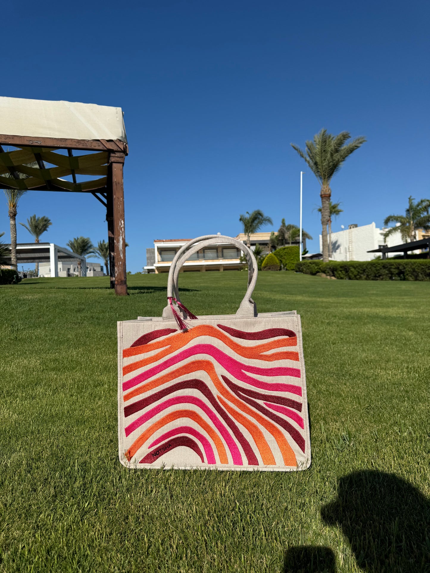 A bold blend of orange, burgundy, and fuchsia.
