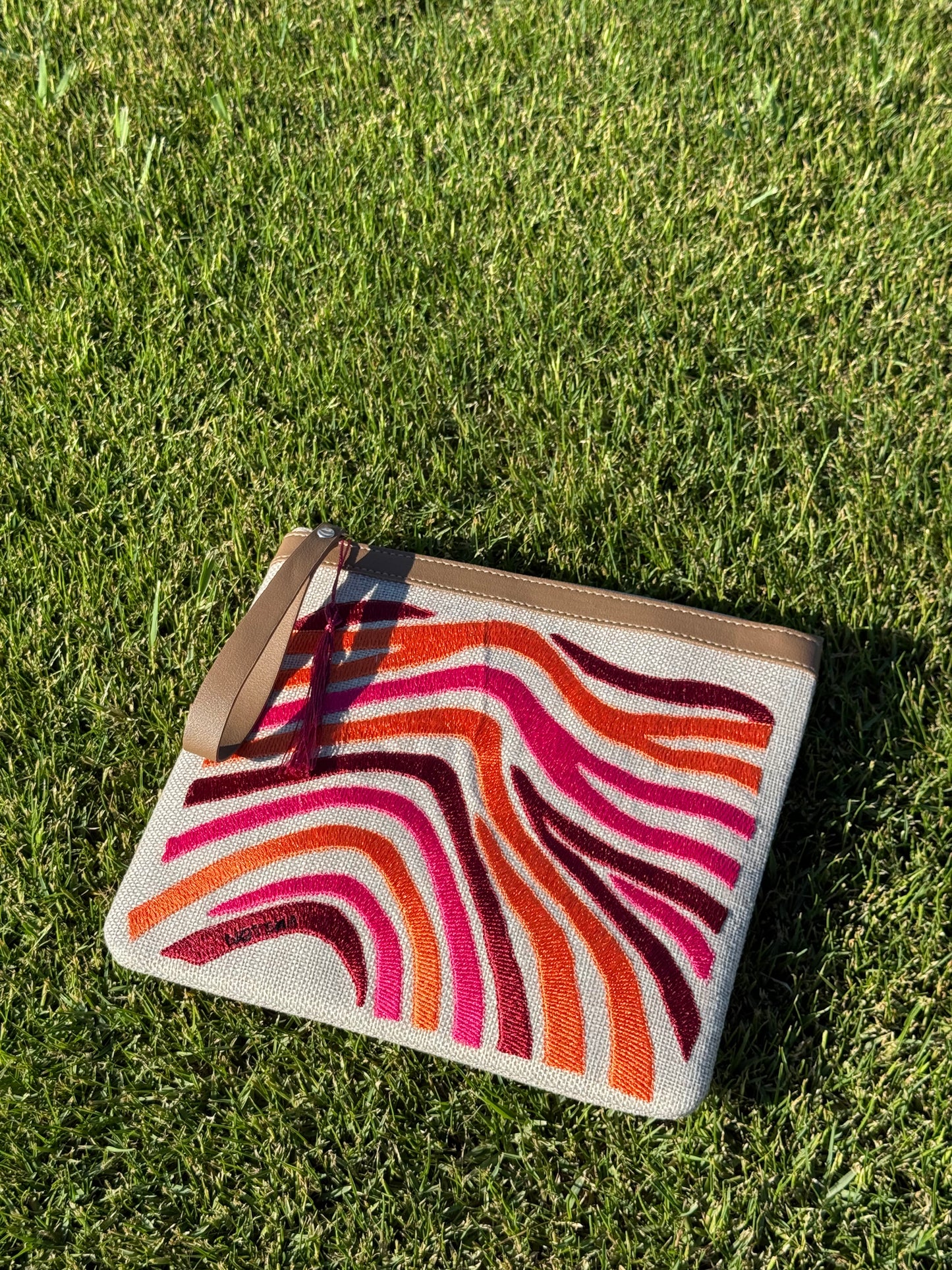 A bold blend of orange, burgundy, and fuchsia.