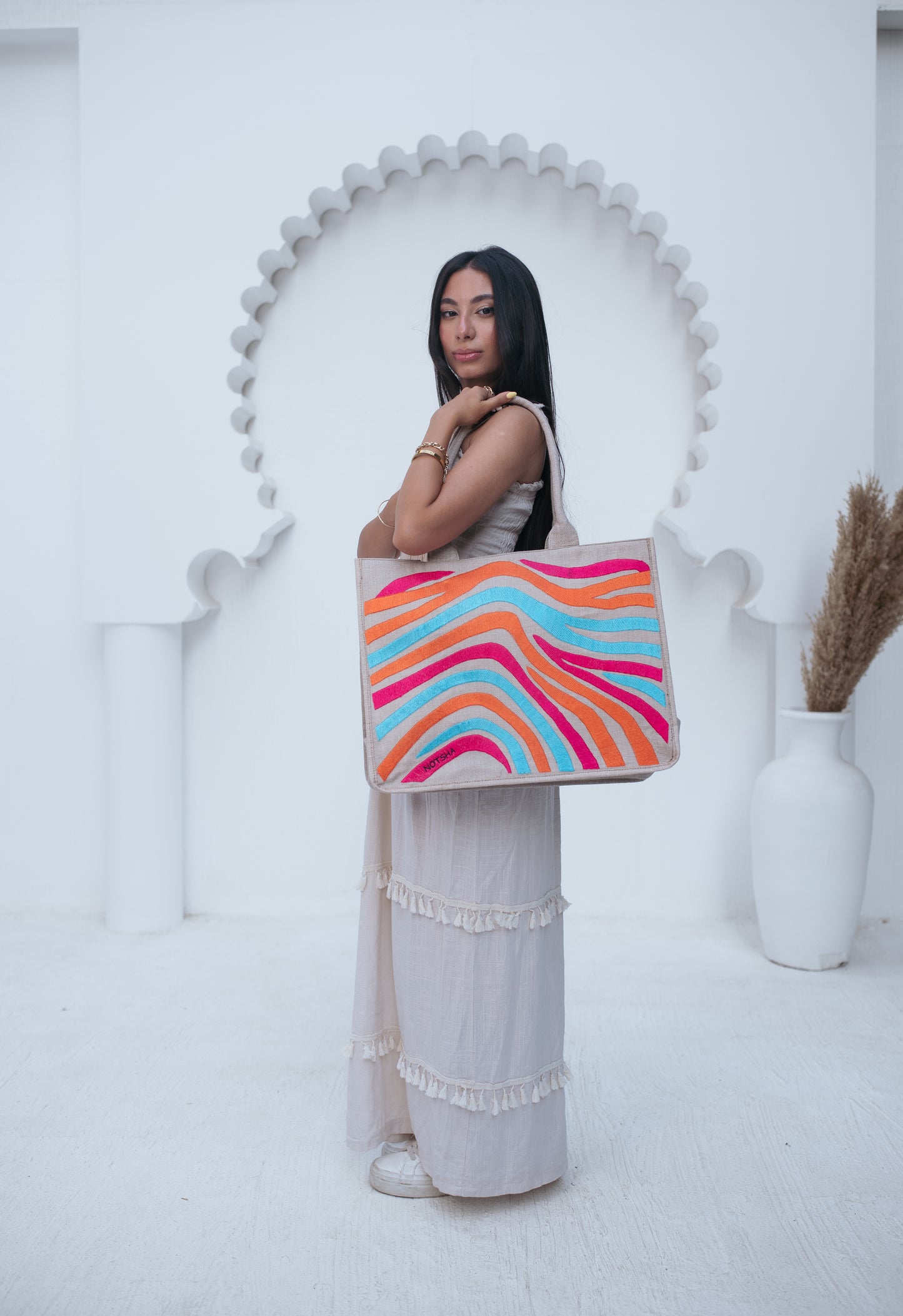 A vibrant blend of turquoise, orange, and fuchsia.