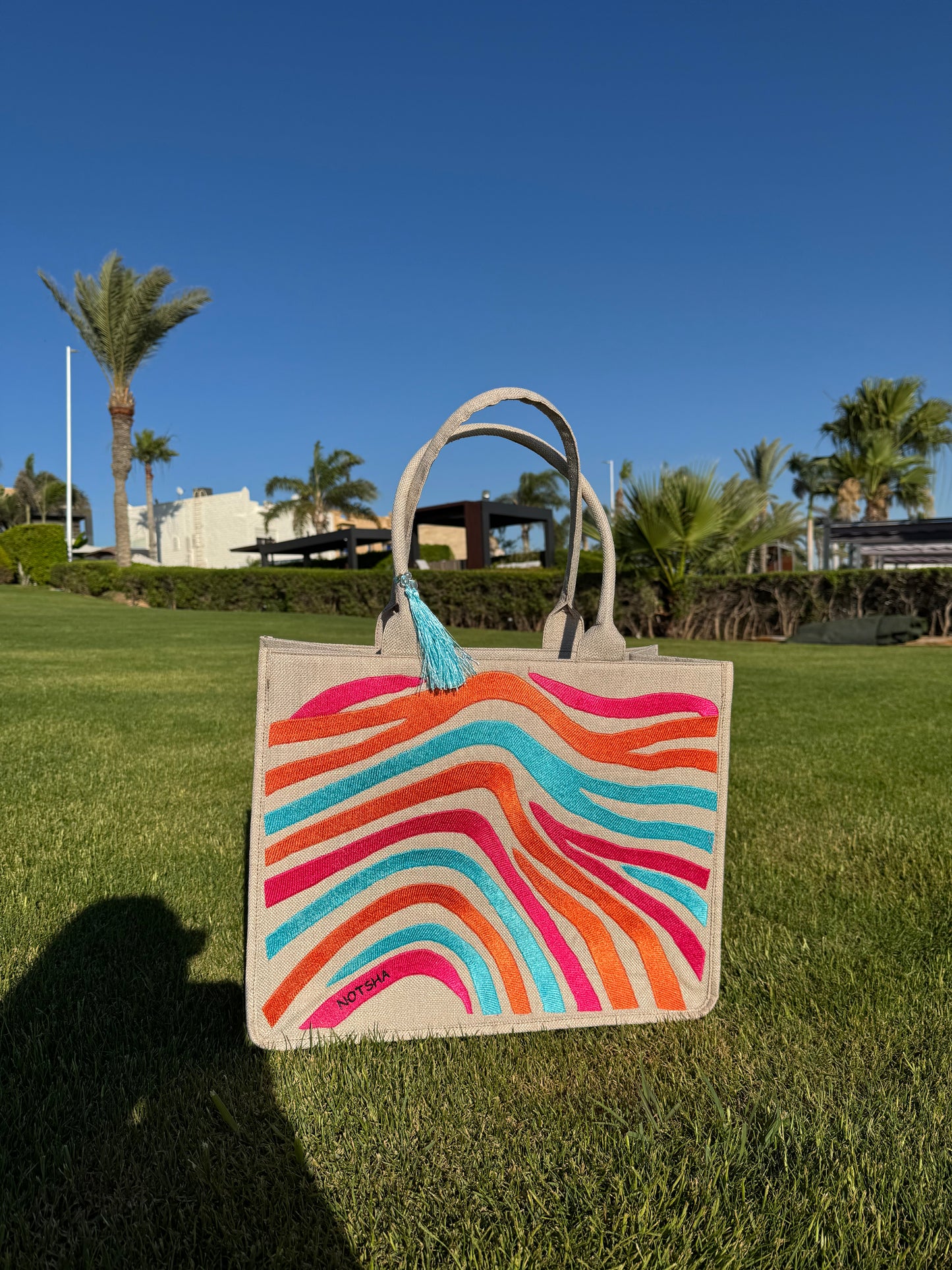 A vibrant blend of turquoise, orange, and fuchsia.